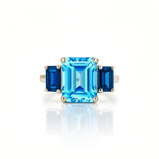 Three Blue Topaz Emerald-Cuts White Gold Ring